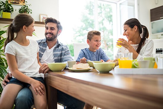 family enjoying summer lunch with air conditioning